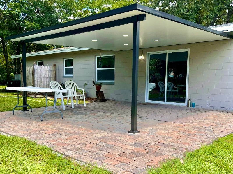 home with black patio cover