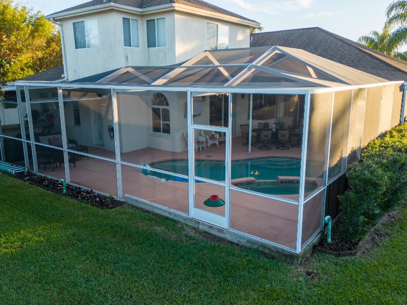 screen enclosure on home with pool